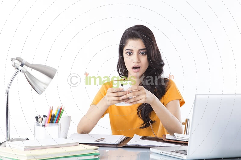 girl talking on phone while studying