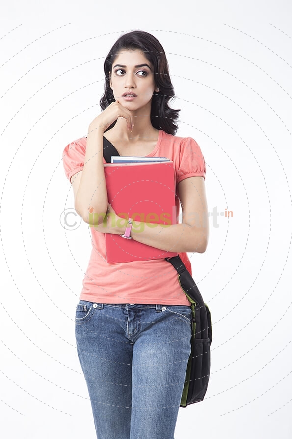 college girl holding text books and posing