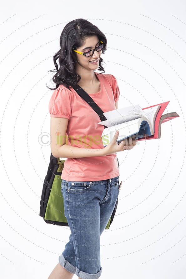 college girl reading text book