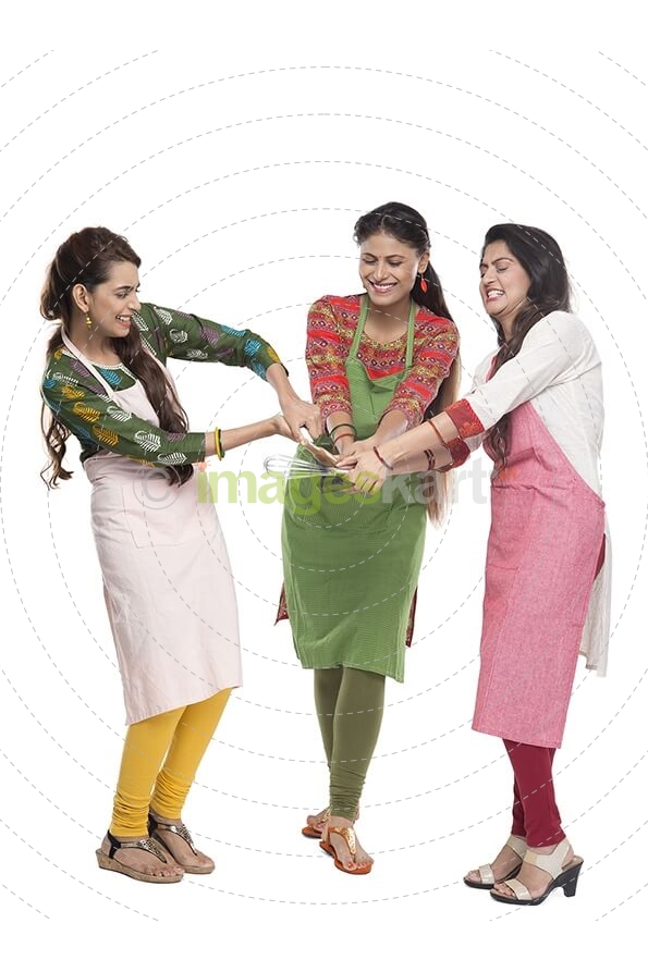 women wearing apron with kitchen utensils