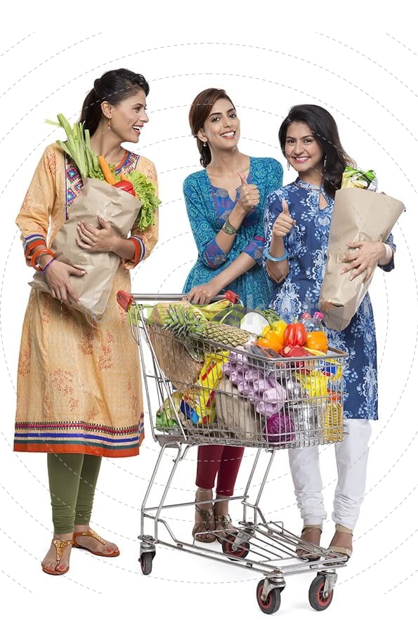 woman posing with shopping bags and shopping cart
