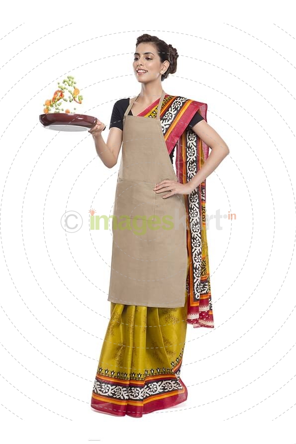 women wearing apron and tossing vegetables in fry pan