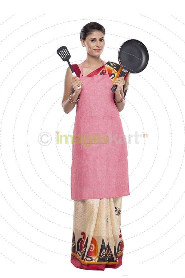 women wearing apron with kitchen utensils