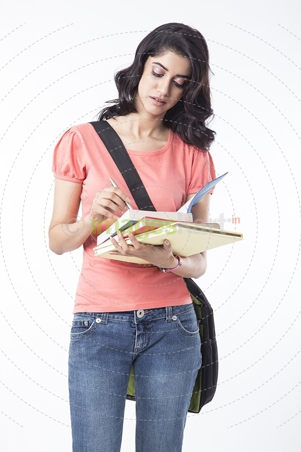 college girl writing on notebook