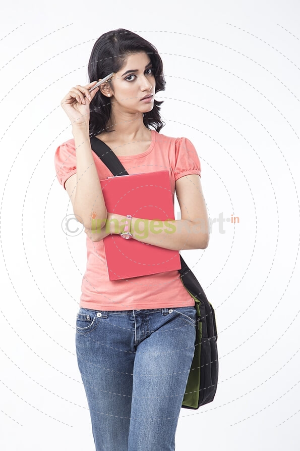 college girl posing with textbooks 