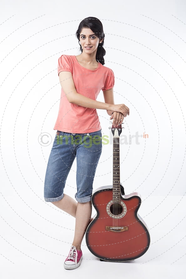 girl posing with guitar