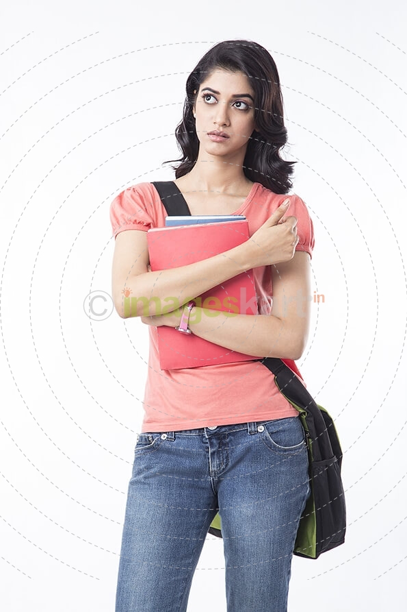 college girl posing with textbooks 