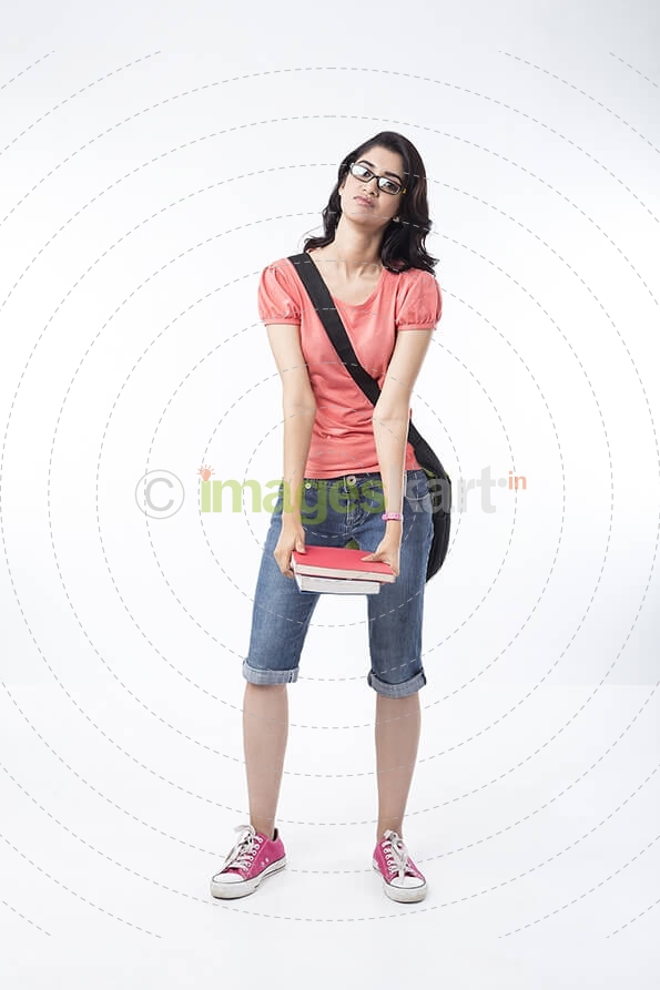 college girl burdened with textbooks