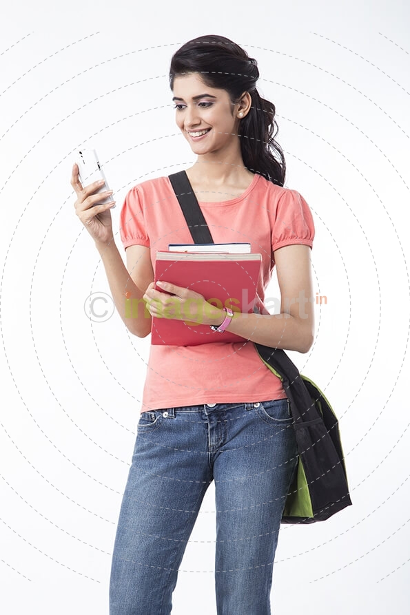 college girl messaging on mobile phone