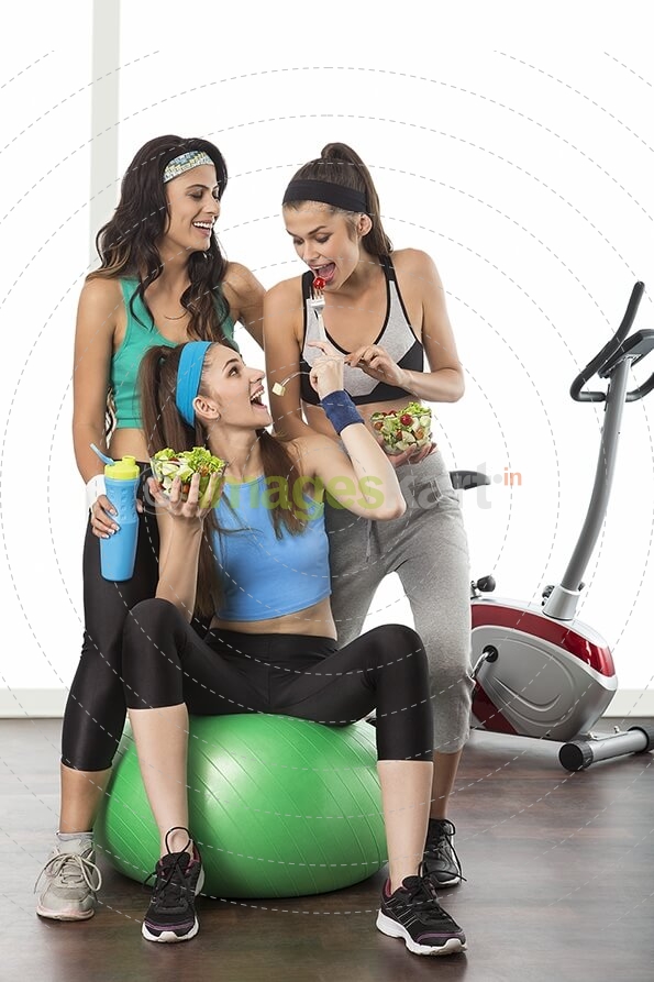 girls in gym having fruit salad