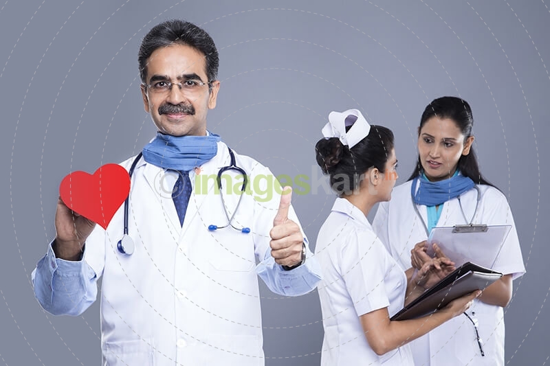 doctor right hand love hearts behind medical staff