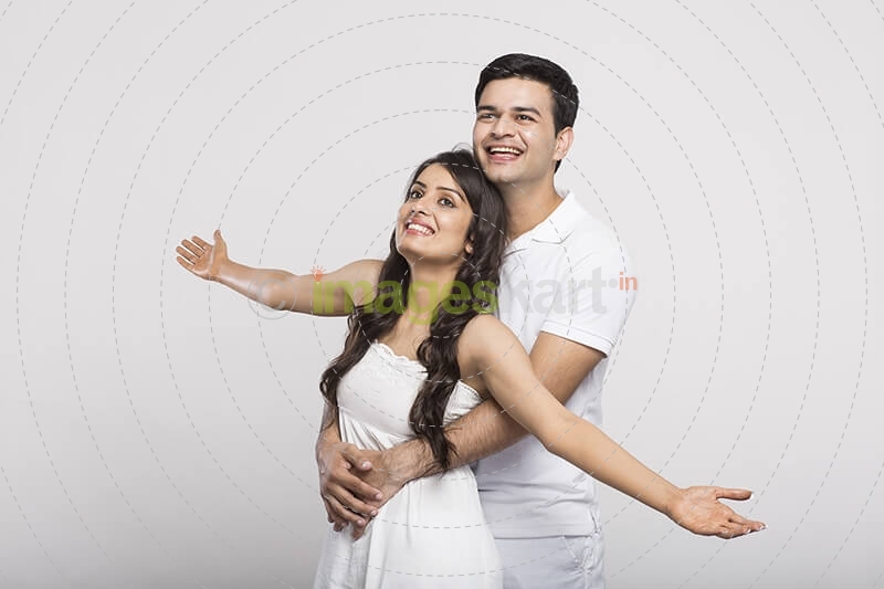 loving couple with open raised their hands