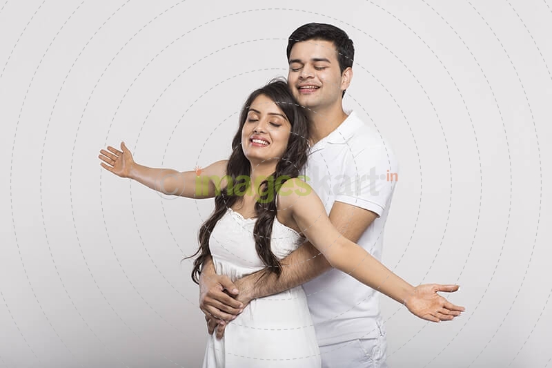 loving couple with open raised their hands