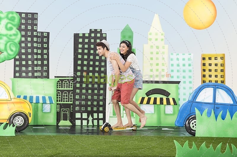Couple playing wit scooter