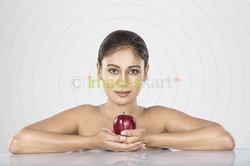 young woman red apple in hand