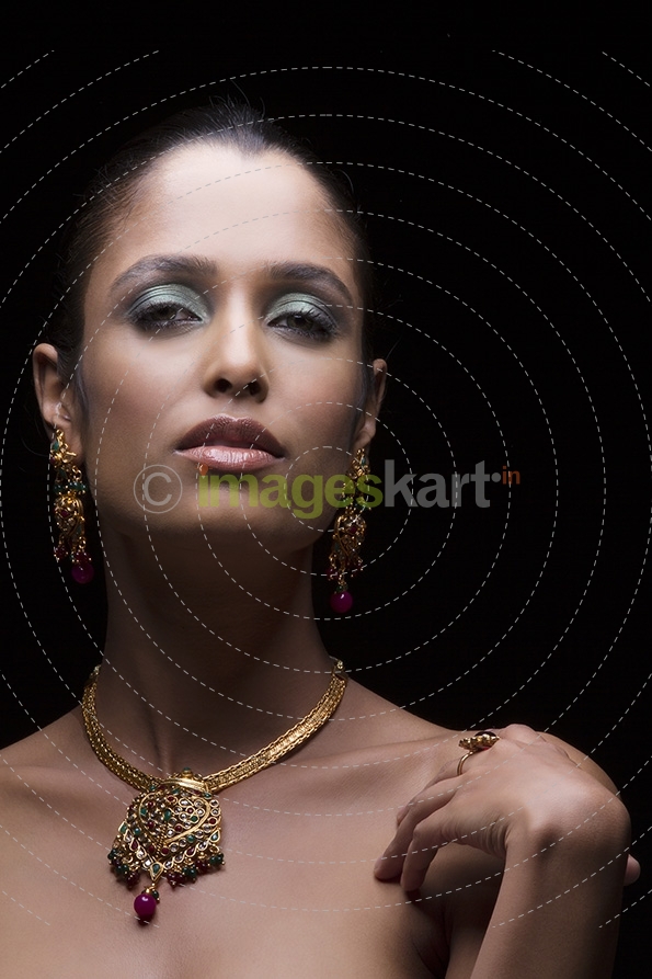 Woman flaunting her gold jewellery