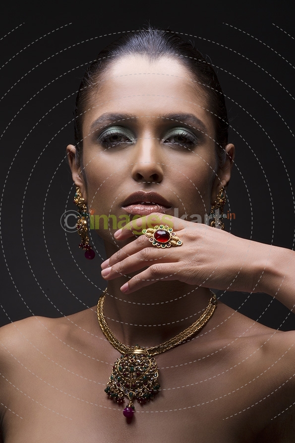 Woman flaunting her gold jewellery