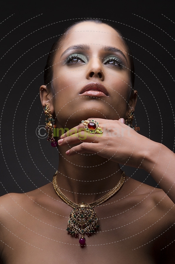 Woman flaunting her gold jewellery