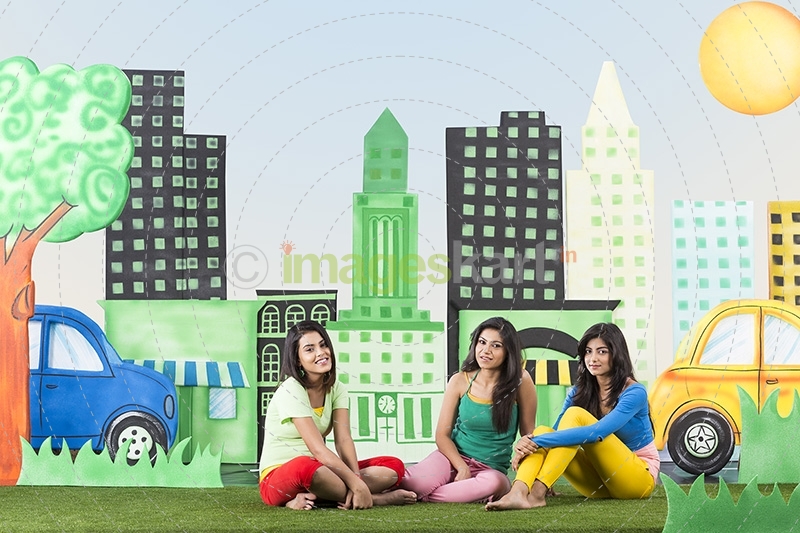 Girl friends sitting and posing