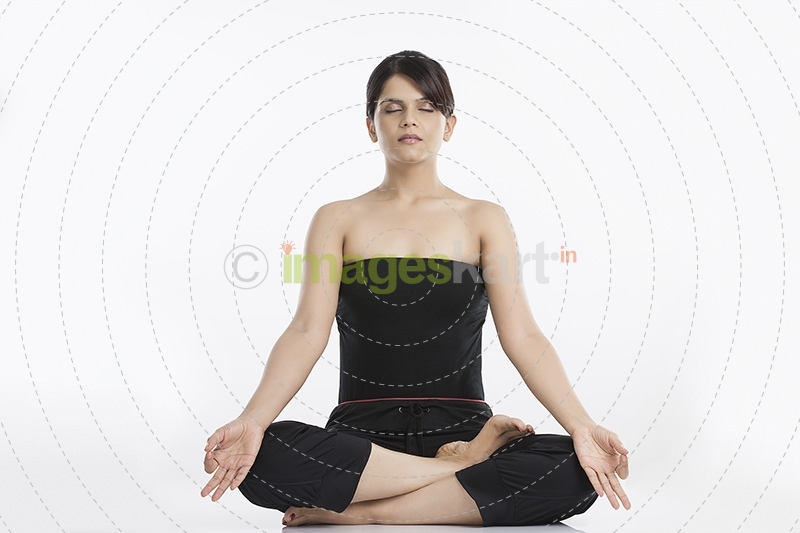 young woman doing yoga exercise