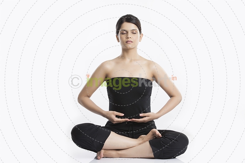 young woman doing yoga exercise