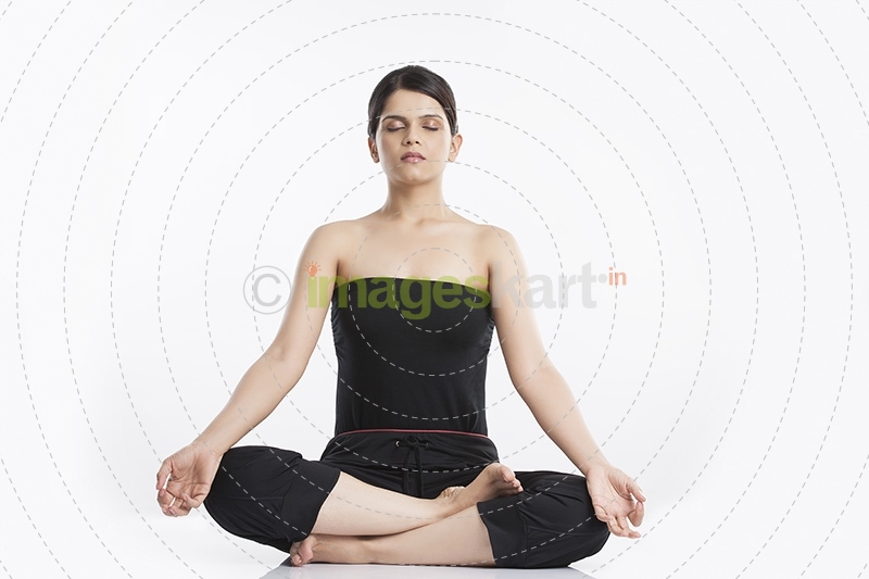 young woman doing yoga exercise