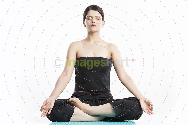 young woman doing yoga exercise