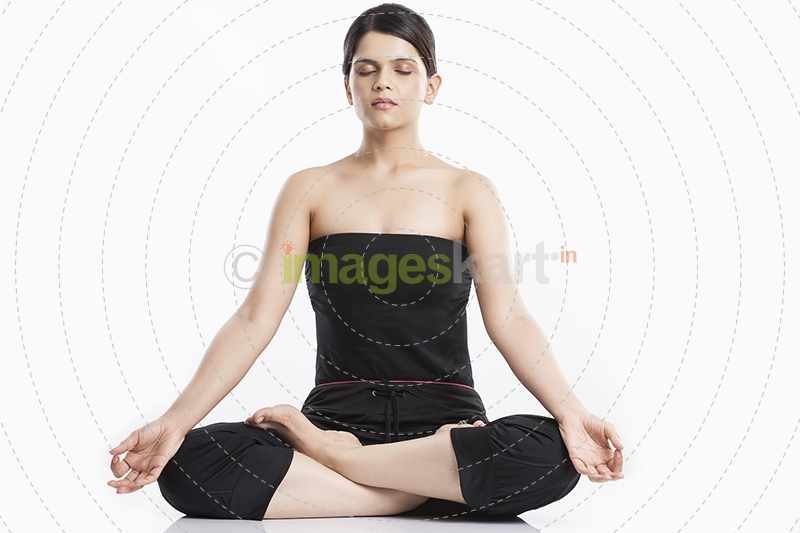 young woman doing yoga exercise