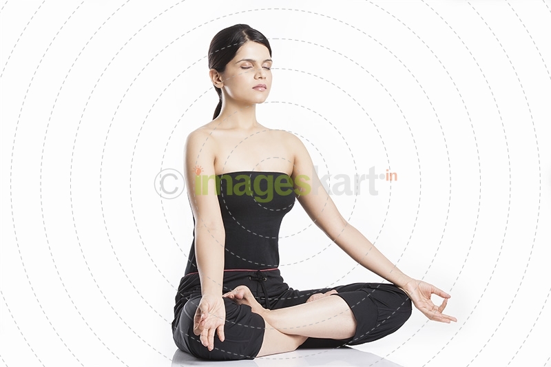 young woman doing yoga exercise