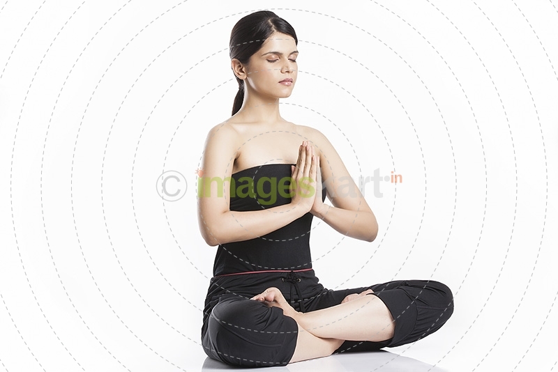 young woman doing yoga exercise