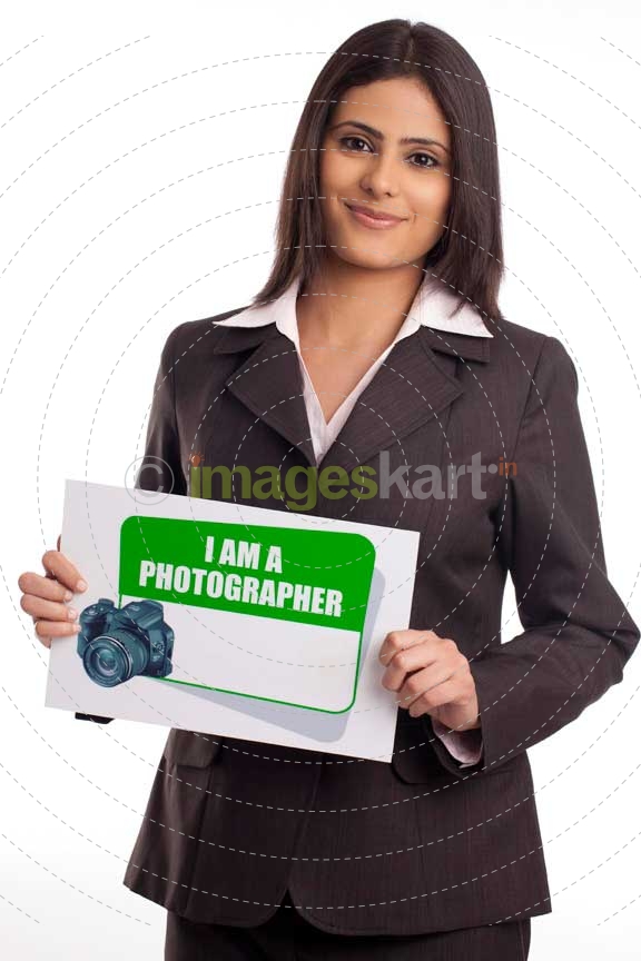corporate woman posing with a message board