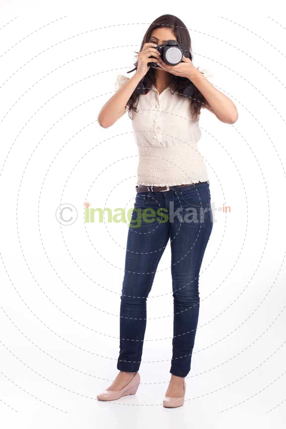 college girl posing with a digital camera