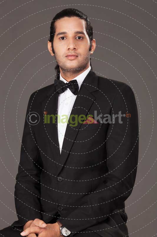 Man posing in a suit