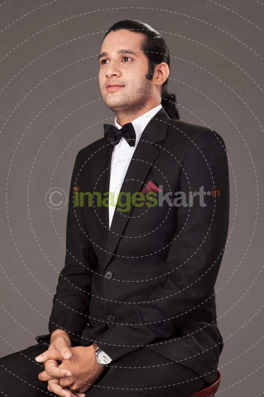 man siting in a suit