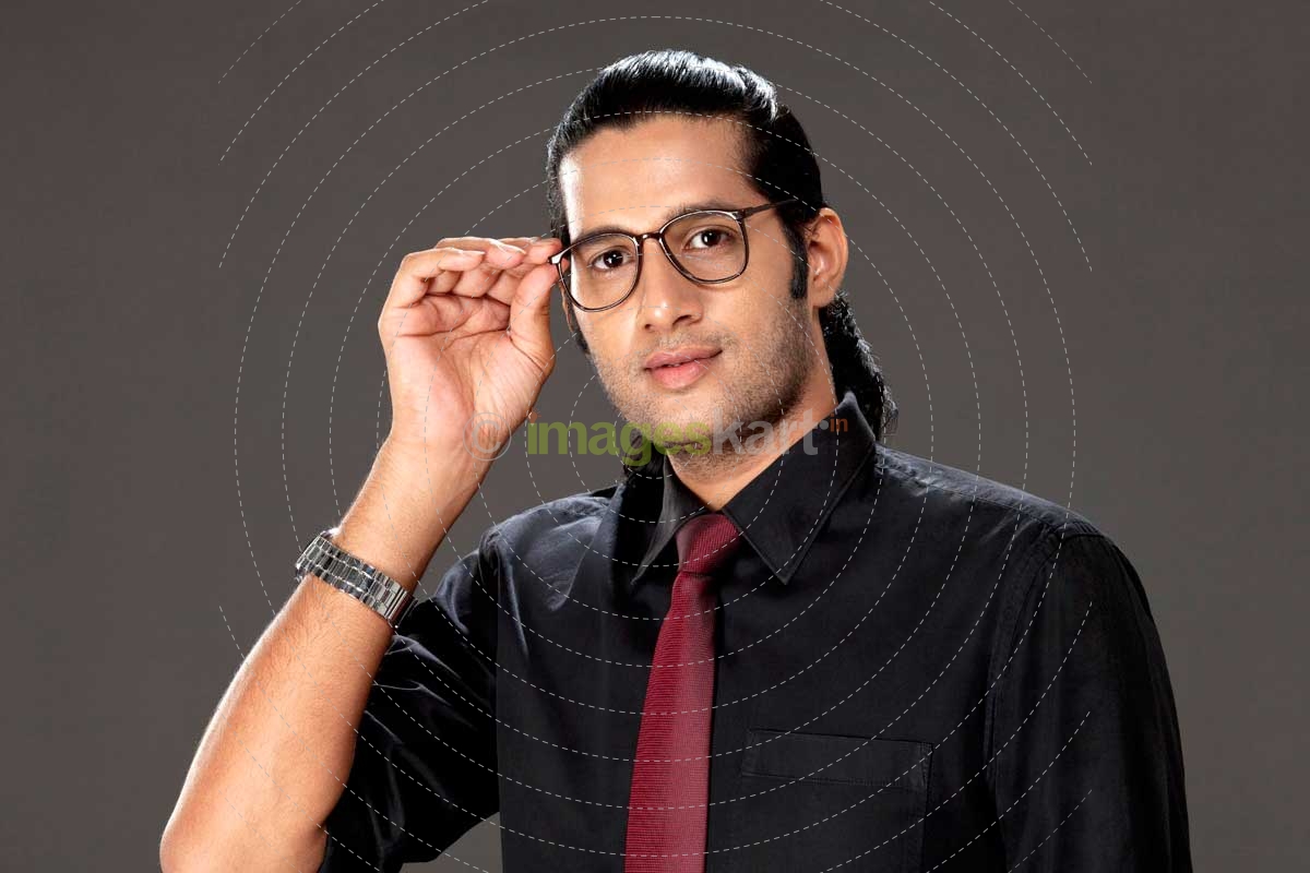 young man posing in office attire 