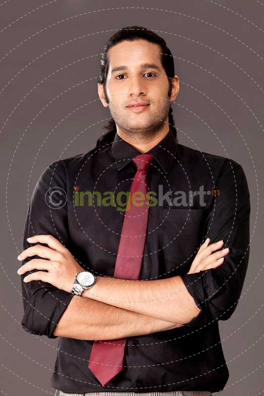 man posing in office attire 
