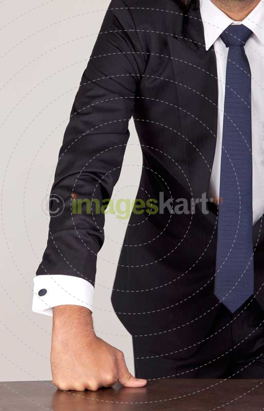 businessman posing on table 