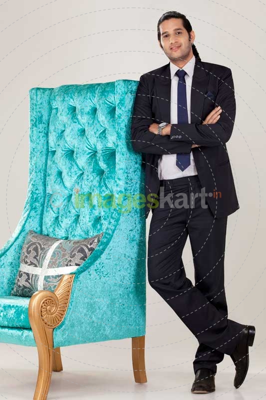 a young dynamic business person looking at the camera and posing 