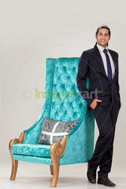 business man reclined on long back chair 