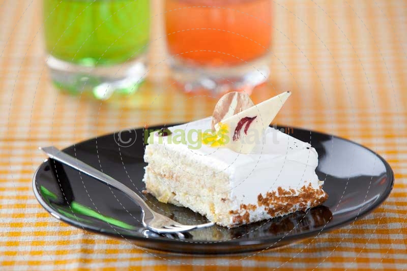 a piece of cream cake ready to be served 
