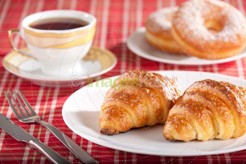 fresh sweet snack with tea and donuts