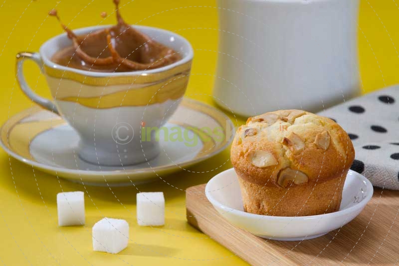a sugar cube splashed in tea