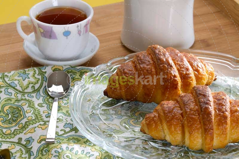 fresh sweet bun with tea and butter