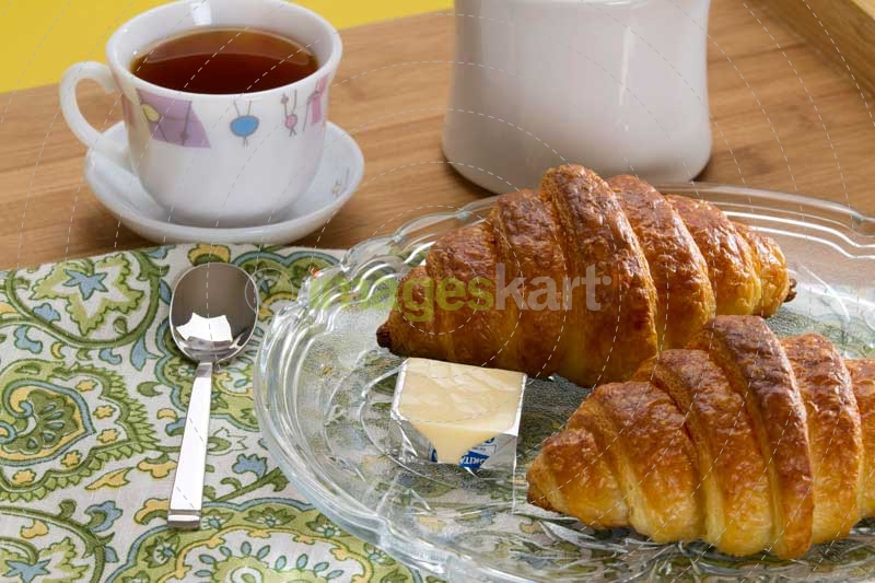 fresh sweet bun with tea and butter