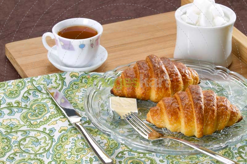 breakfast with sweet croissant and tea