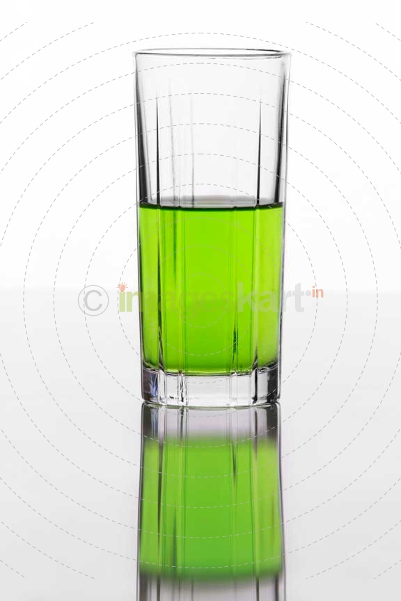half filled glass of a soft drink