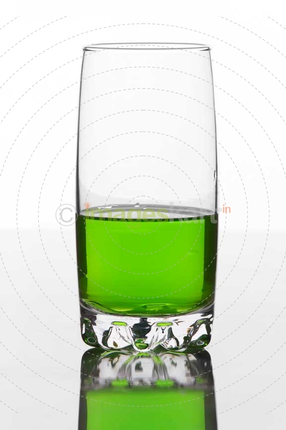 half filled glass of a soft drink