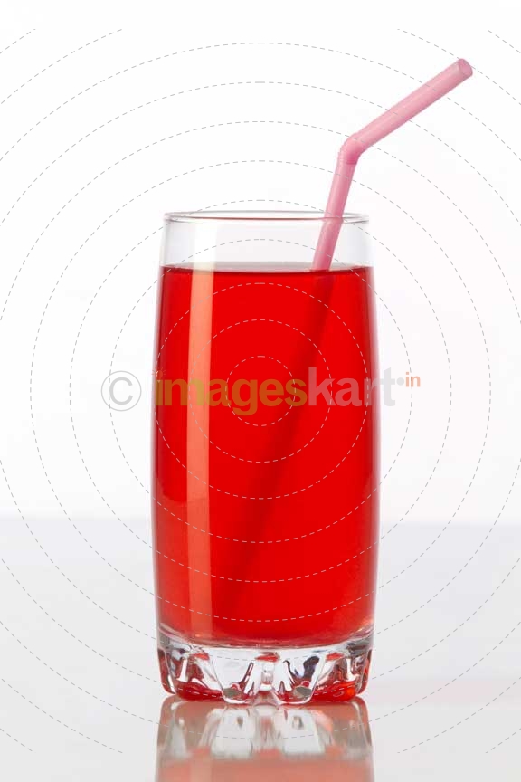 red coloured soft drink against a white background