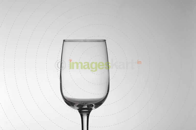 empty wine glass against white background