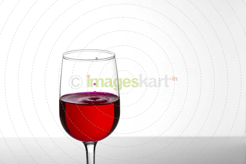 glass of wine against white background